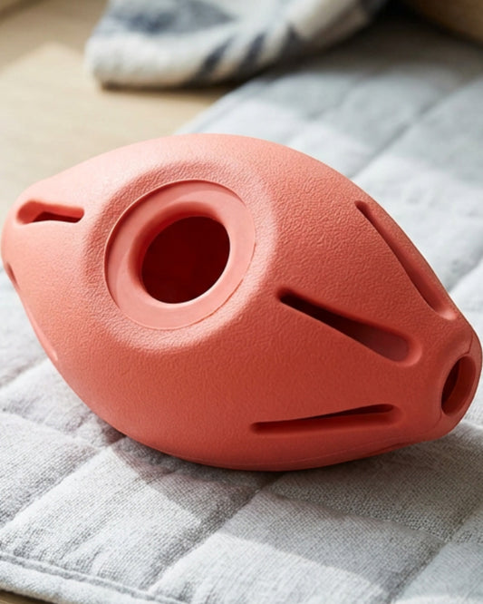 Aerovy Pebbletreat Natural Rubber Treat Pod Dog Toy 4.2 in Coral - Lifestyle view